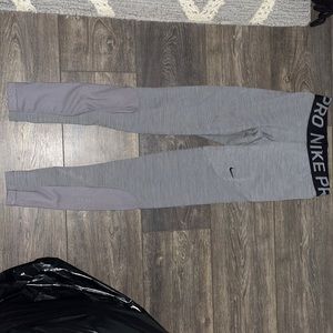 This are gray Nike athletic leggings. Smooth texture get for if you sweat a lot.